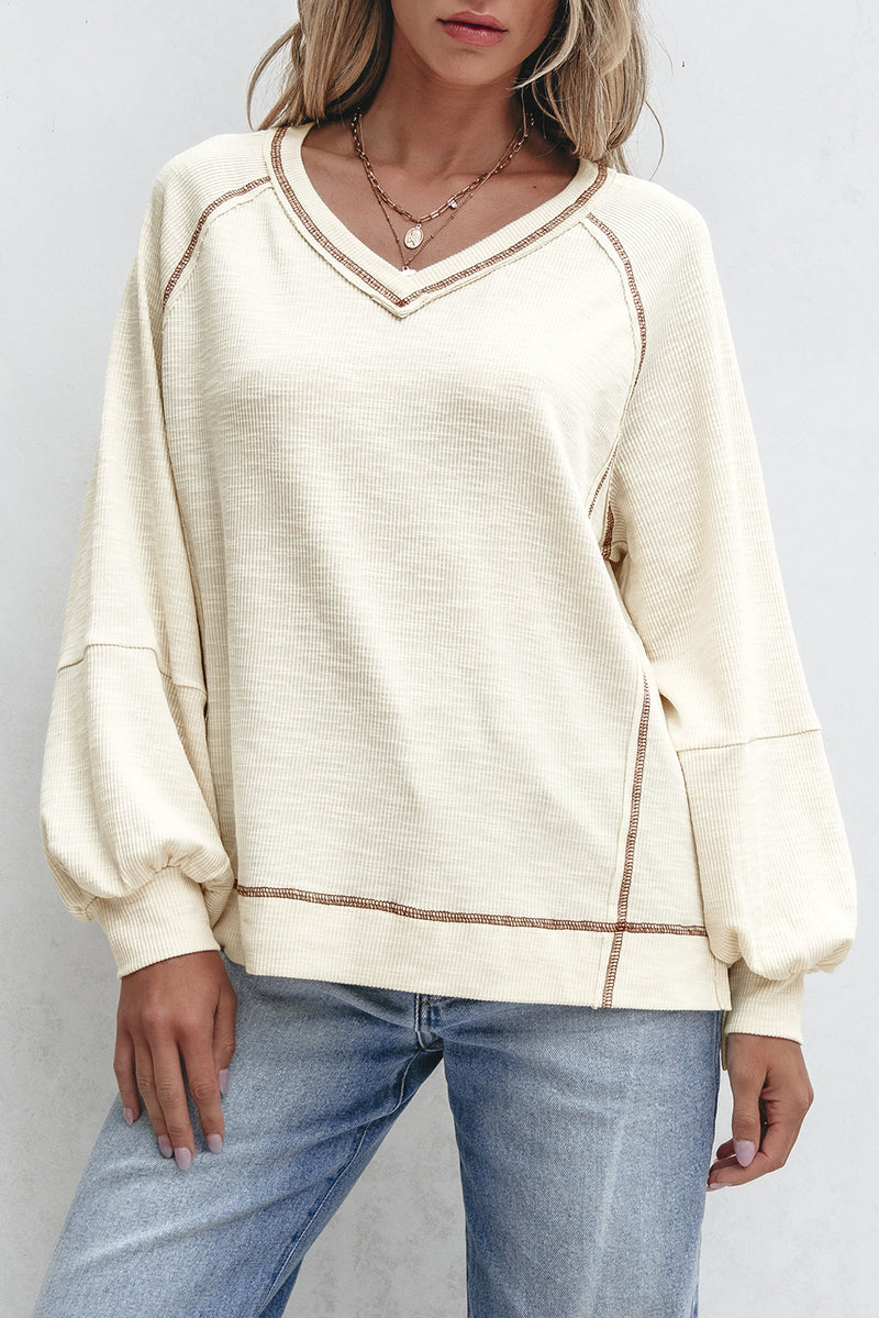 Solid Exposed Seam Textured Knit V Neck Pullover Top