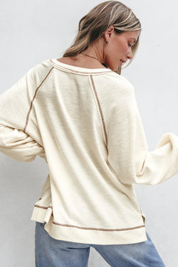 Solid Exposed Seam Textured Knit V Neck Pullover Top